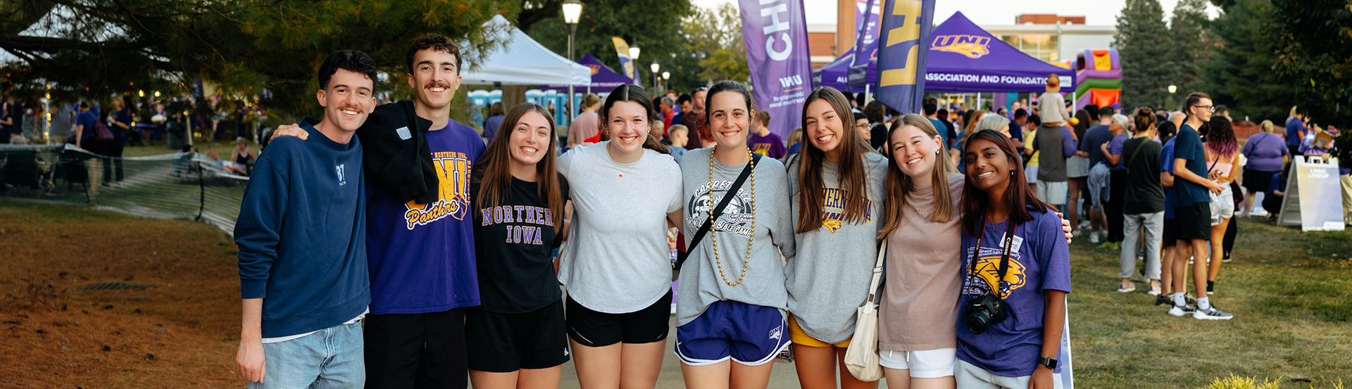 Students smiling at Homecoming Friday Night Bash