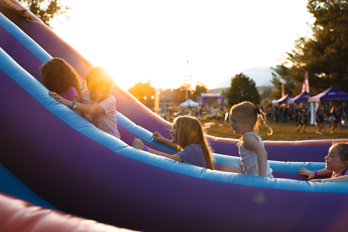 Children on inflatable slide at UNI Homecoming Bash